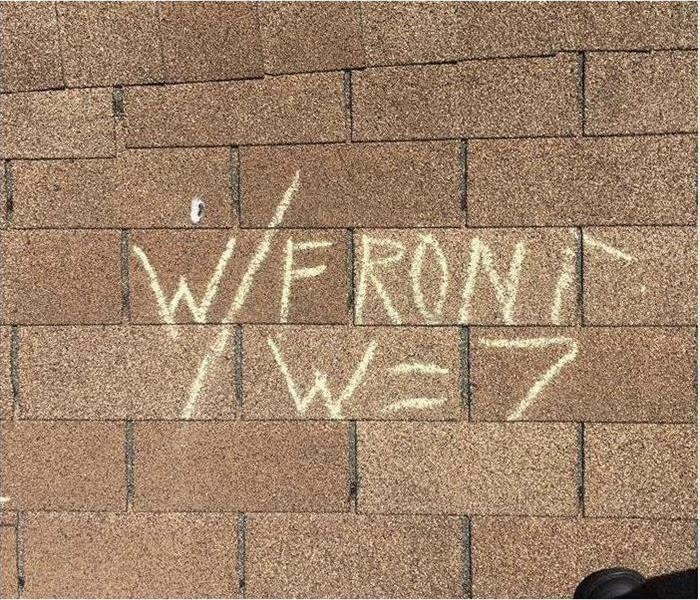 Brick wall with the text "W/FRONT W=7" on it.
